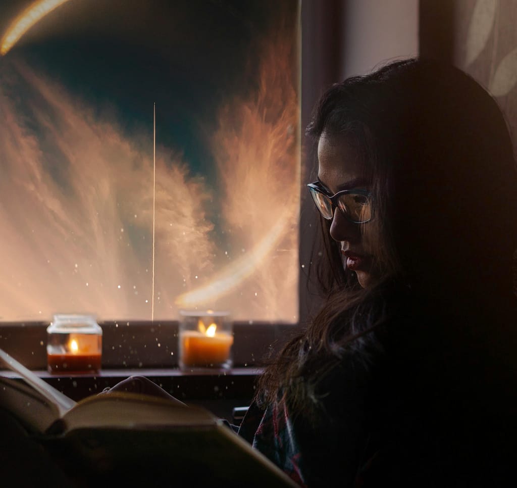 Cozy bedroom with warm lighting and no screen glow, illustrating healthy pre-sleep habits. Comparison of Night Mode vs Blue Light Glasses for eye protection