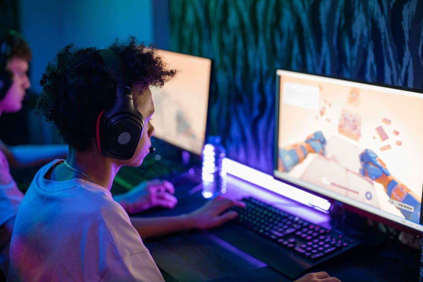 A young gamer focusing intensely on a screen, representing visual focus and strain during gaming.
